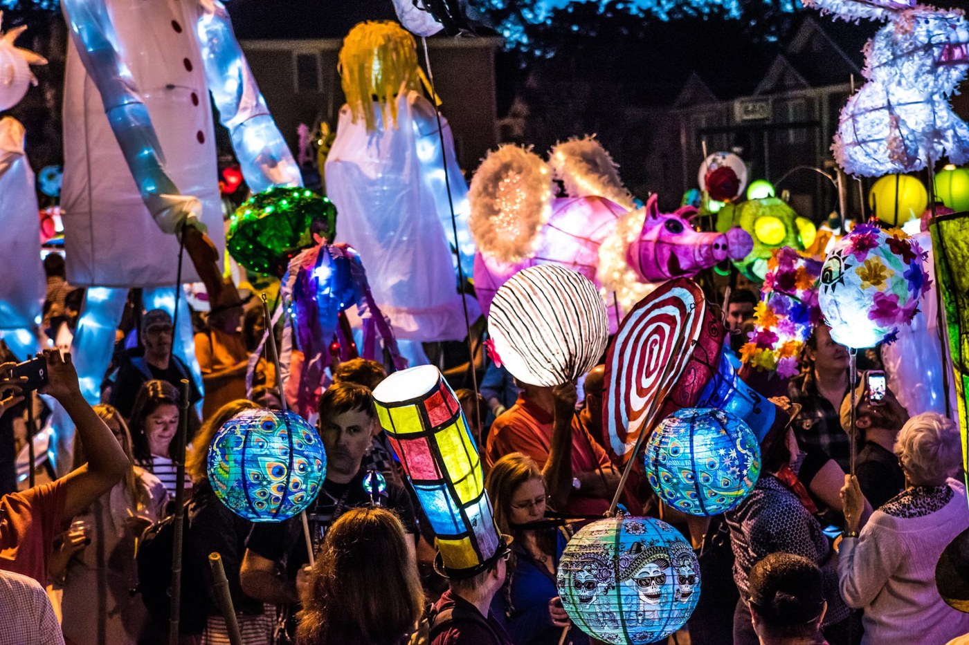Glowing handmade lanterns at a night parade
